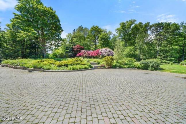 Five-bedroom estate on 56+ acres features gardens, a pool, and more