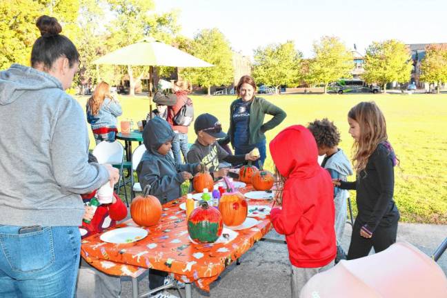 <b>Children paint pumpkins at Norwescap’s Fall Frolic in the Park on Thursday, Oct. 10 at Sussex County Community College in Newton. (Photos by Maria Kovic)</b>