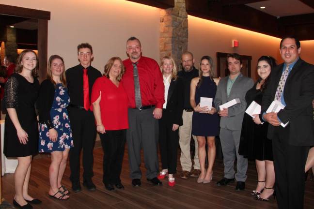 From left are Emily Parete of the Newton Medical Center Emergency Department; Julia Moran of Saint Clare’s Paramedics; Cody, Heidi and Keith Cooper; Megan Sandow, chief development officer of the Newton and Hackettstown medical denters; Brian Walsh, a Sussex County 911 dispatcher; and Abigail Casario, Andrew Dietz, Kizzy Esquivel and William Frannicola, all of Hampton Fire &amp; Rescue.