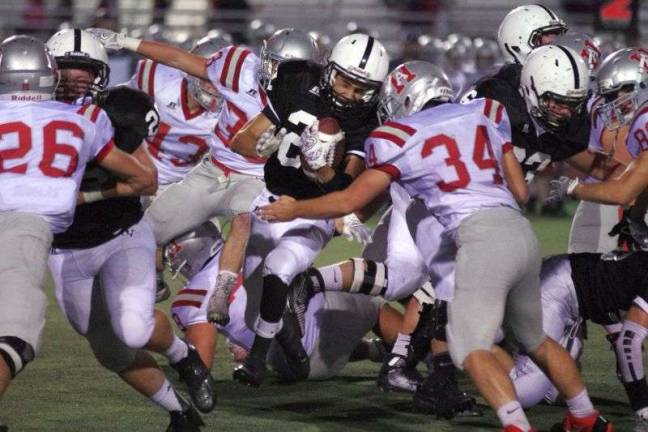 A Delaware Valley ball carrier and a Hazleton linebacker collide (Photo by George Leroy Hunter)