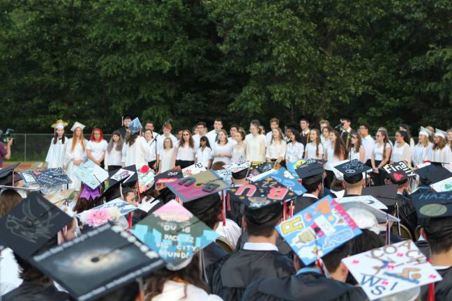 The DV Chorus performs at Friday's graduation ceremonies under the leadership of senior Bronwen Yoncak. (Photo by Elizabeth Bobo)