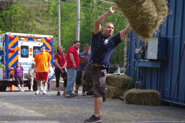 Delaware Township Volunteer Ambulance Corp EMT Brandon Thorngren of Dingmans Ferry won third place in the mens division in the Hay Bale Throwing Contest.