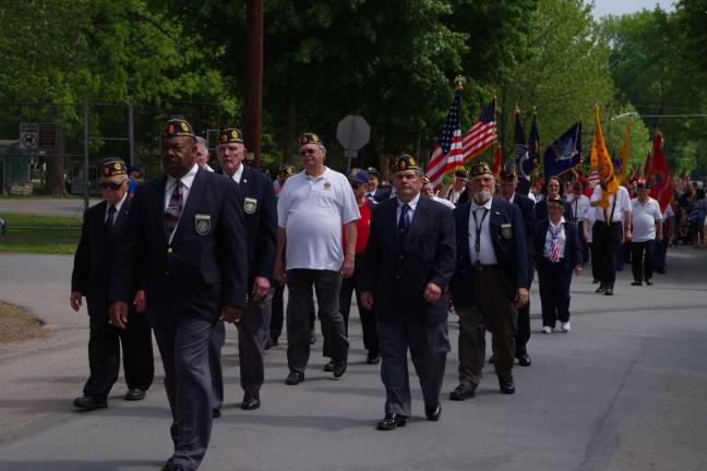 American Legion Post 139 Post Commander Gene Hudson leads marchers along the parade route.