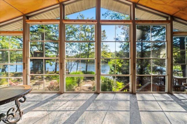 Updated home offers a lakefront sanctuary with private dock