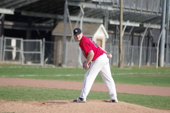 Delaware Valley pitcher Jeff Hupfer glances towards first base.