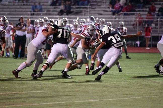 Delaware Valley defenders close in on a Hazleton ball carrier (Photo by George Leroy Hunter)