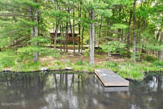 Lakefront log cabin in a private setting is a slice of paradise