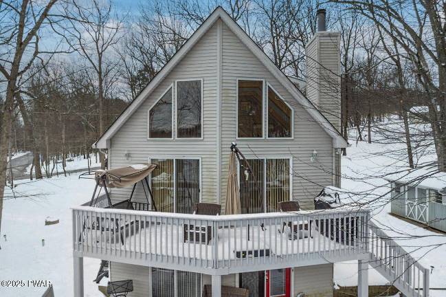 Enjoy the beach from this custom lakefront chalet