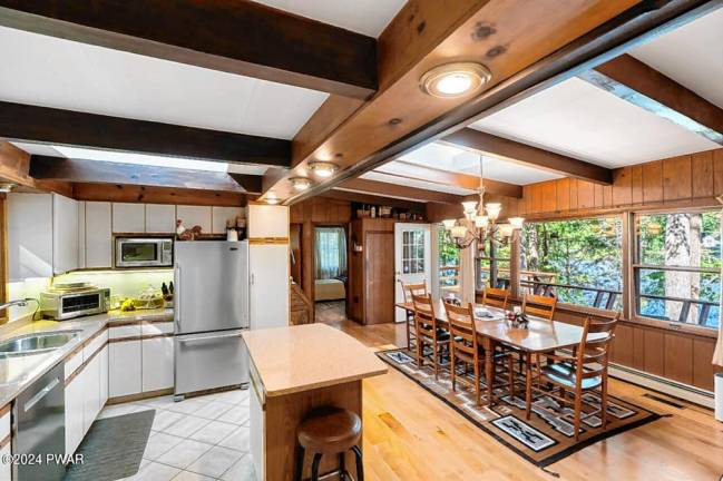 Lakefront home features custom boathouse, dock, and much more