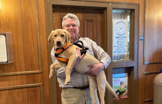 Pike County Treasurer John Gilpin and his licensed dog, Maine.<b> </b>