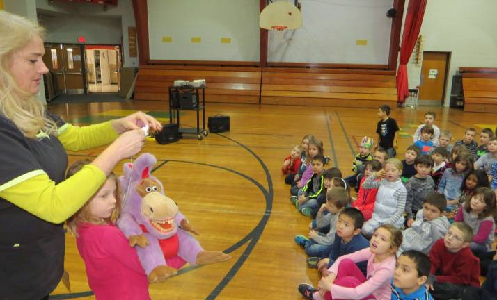After the show, Amato (pictured with first grade Chloe Longhenry) spoke to the first graders in Colleen Hiller's, Paige Padgett's, and Amy Ross' classes. She spoke about the importance of good dental hygiene.