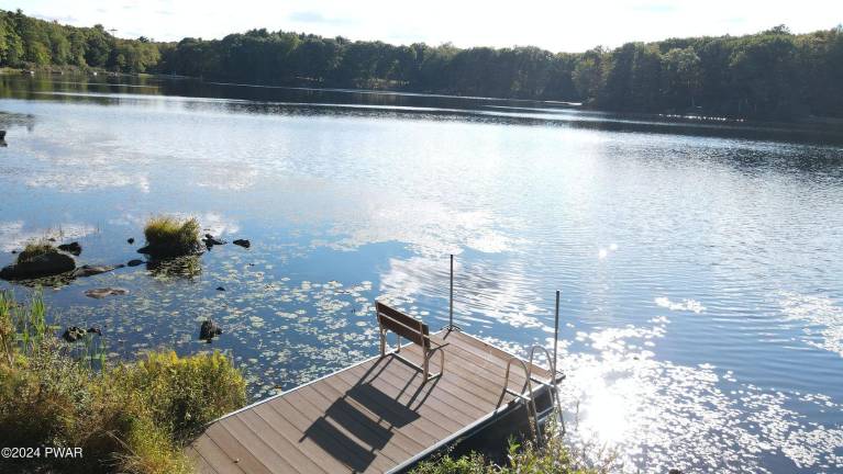 Upscale colonial on a pristine lake surrounded by woods