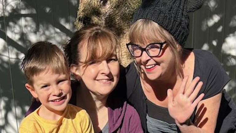 Green Trees Director Susie Lyddon (right) with infant lead teacher Jess Shadler and a Green Trees student.